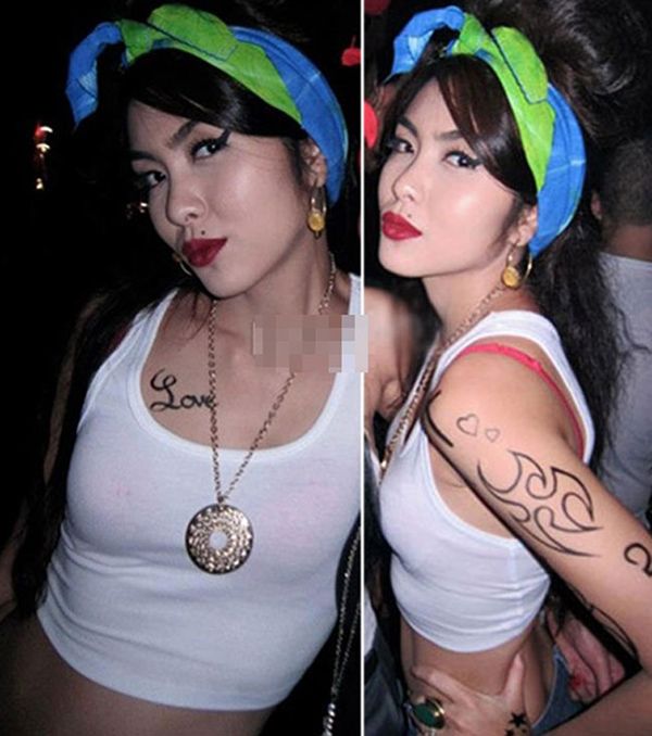 Tăng Thanh Hà hóa trang thành ca sĩ Amy Winehouse với chiếc áo ba lỗ trắng.