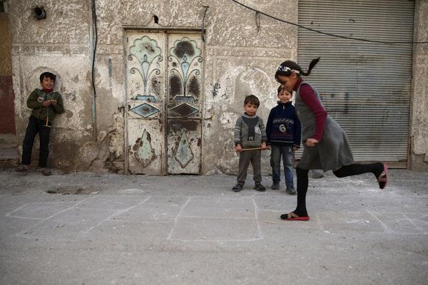 Children play in the Douma neighborhood of Damascus, Syria November 26, 2015. REUTERS/Bassam Khabieh
