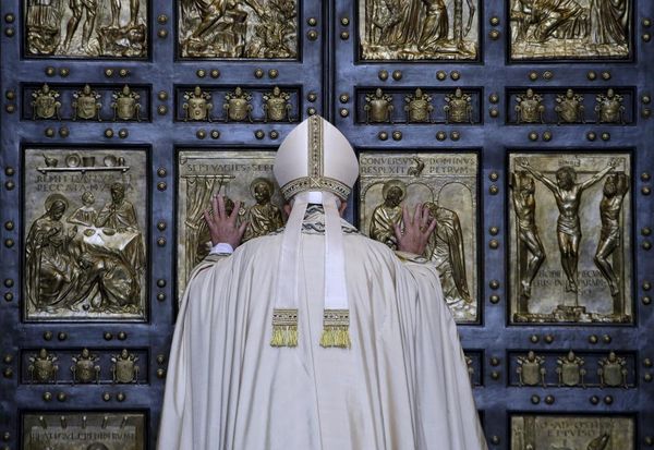 Pope Francis opens the Holy Door to mark opening of the Catholic Holy Year, or Jubilee, in St. Peter's basilica, at the Vatican, December 8, 2015. REUTERS/Max Rossi