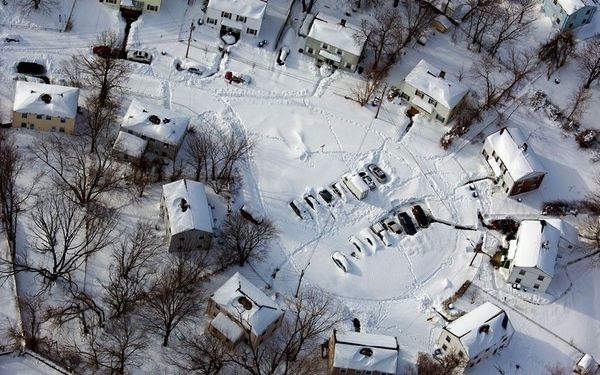 16 Cars and houses in a southwest Connecticut neighbourhood are covered in snow